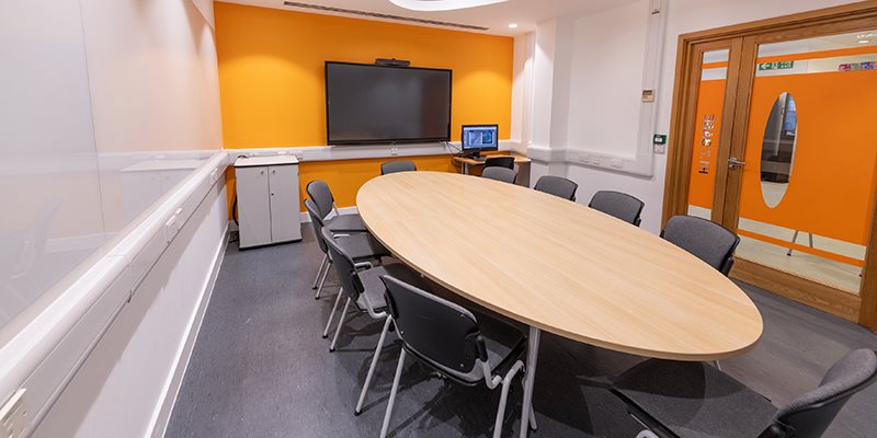 Empty base teaching room with chairs positioned round a table