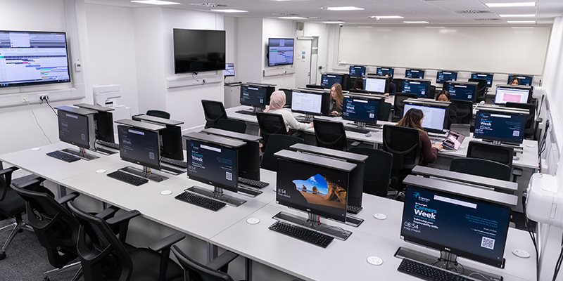 Computers on desks in computer room