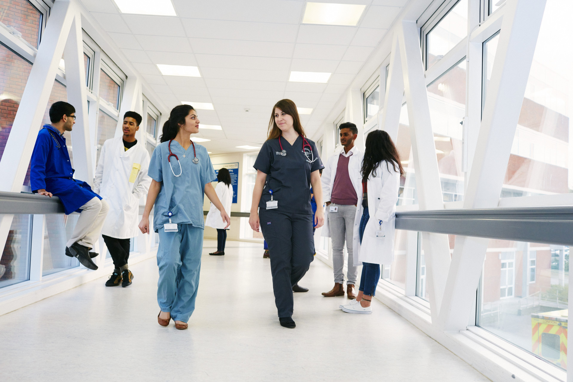 Medical students walking in a corridor.