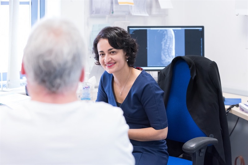 Professor Nidhi Sofat working with a patient.