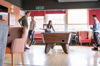 Students playing pool in the SU