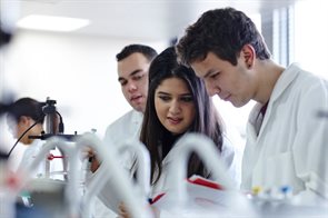 An student doctor walking a hospital corridor.